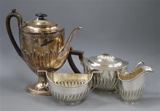 A matched late Victorian demi fluted silver four piece tea and coffee set, London, 1895 & Sheffield, 1895, gross 52.5 oz.